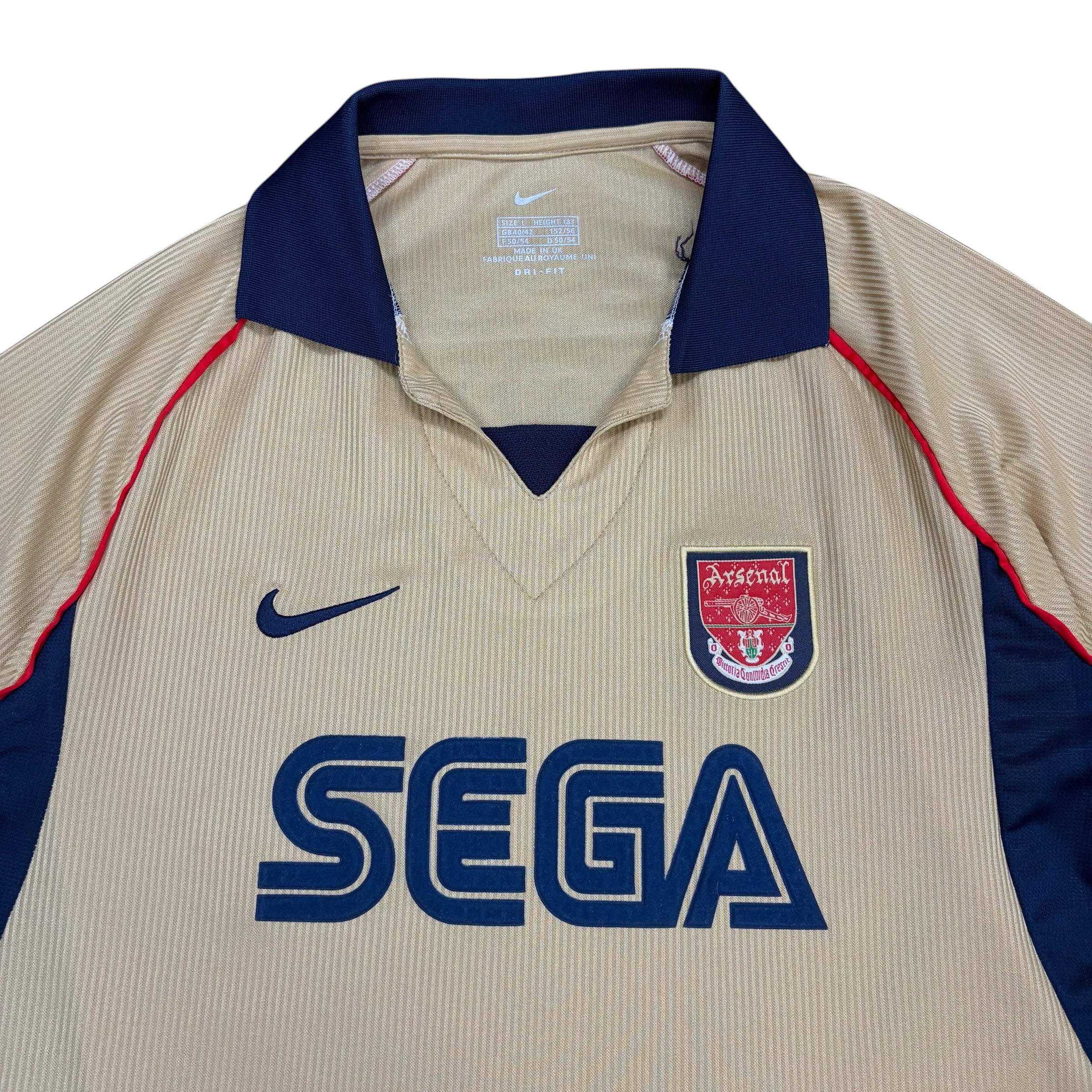 mestizo vintage Arsenal FC gold away jersey with navy collar, SEGA sponsor, and Nike logo